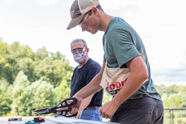 Consider good paying jobs for teenagers in construction; here, a teenage construction worker learns from an experienced professional